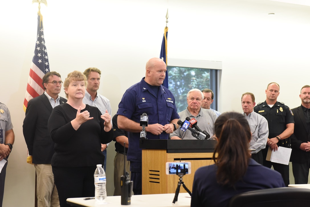 Capt. John Reed, Commander of Coast Guard Sector Charleston delivers safety messages and the current condition of the Port of Charleston during a press briefing at the Charleston County Emergency Operations Center on Tuesday Sept. 3, 2019.