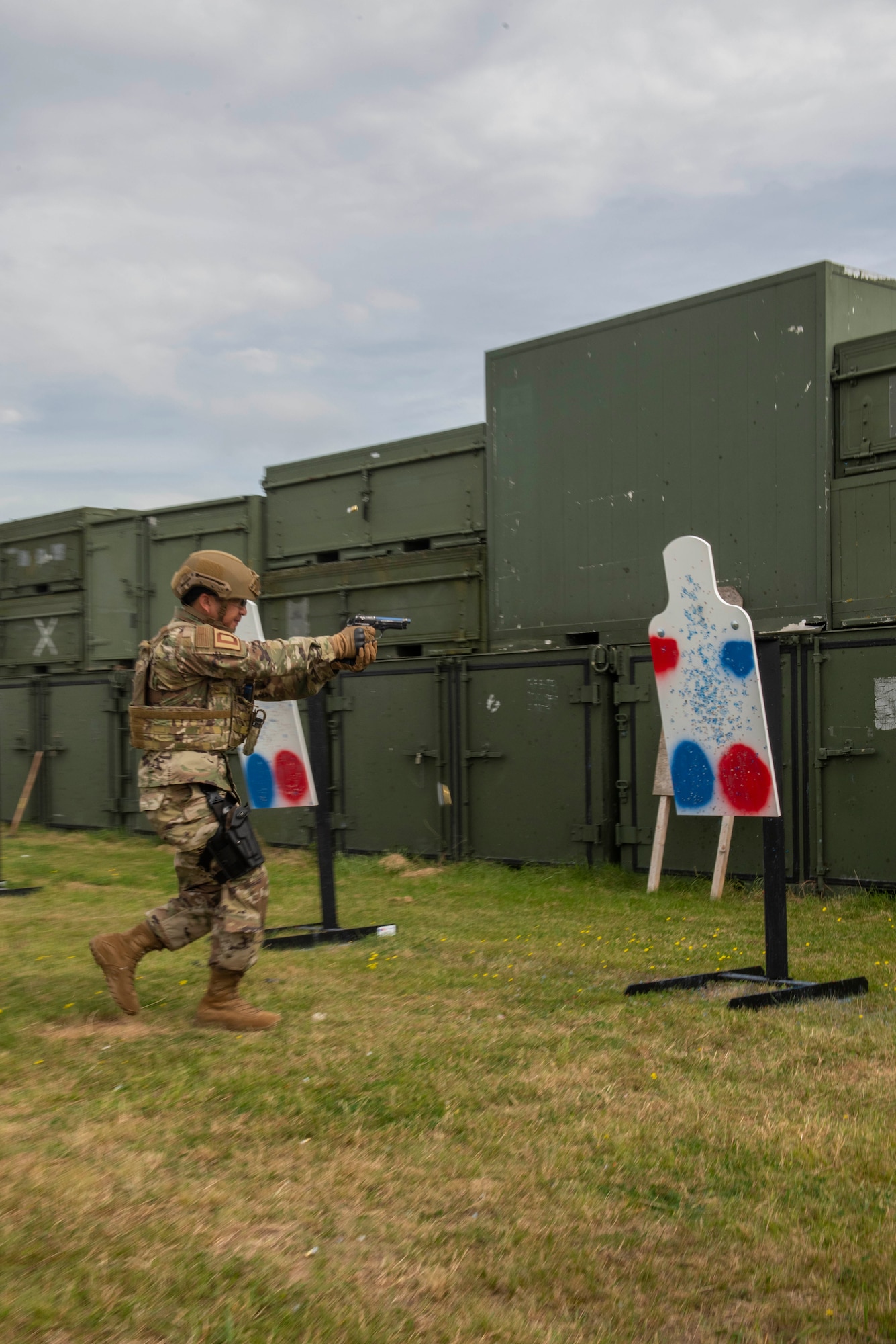 Col. Troy Pananon, 100th Air Refueling Wing commander shoots an M9 pistol during shoot, move and communicate training with Airmen from the 100th Security Forces Squadron at RAF Mildenhall, England, Aug. 30, 2019. Airmen from 100th SFS are RAF Mildenhall’s first line of defense against any adversary and are highly trained law enforcement and they are combat arms specialists prepared to protect and serve their fellow Airmen around-the-clock. They have similar responsibilities as civilian officers, including responding to emergencies, directing traffic and investigating crimes on base. (U.S. Air Force photo by Senior Airman Luke Milano)