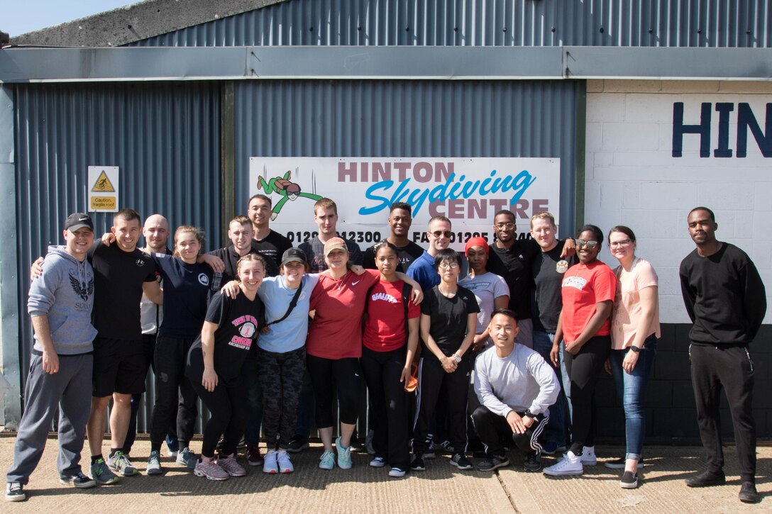 A group of servicemembers from the 501st Combat Support Wing pose before taking part in tandem skydives as part of a Chapel-sponsored resiliency program. (Air Force Courtesy Photo)
