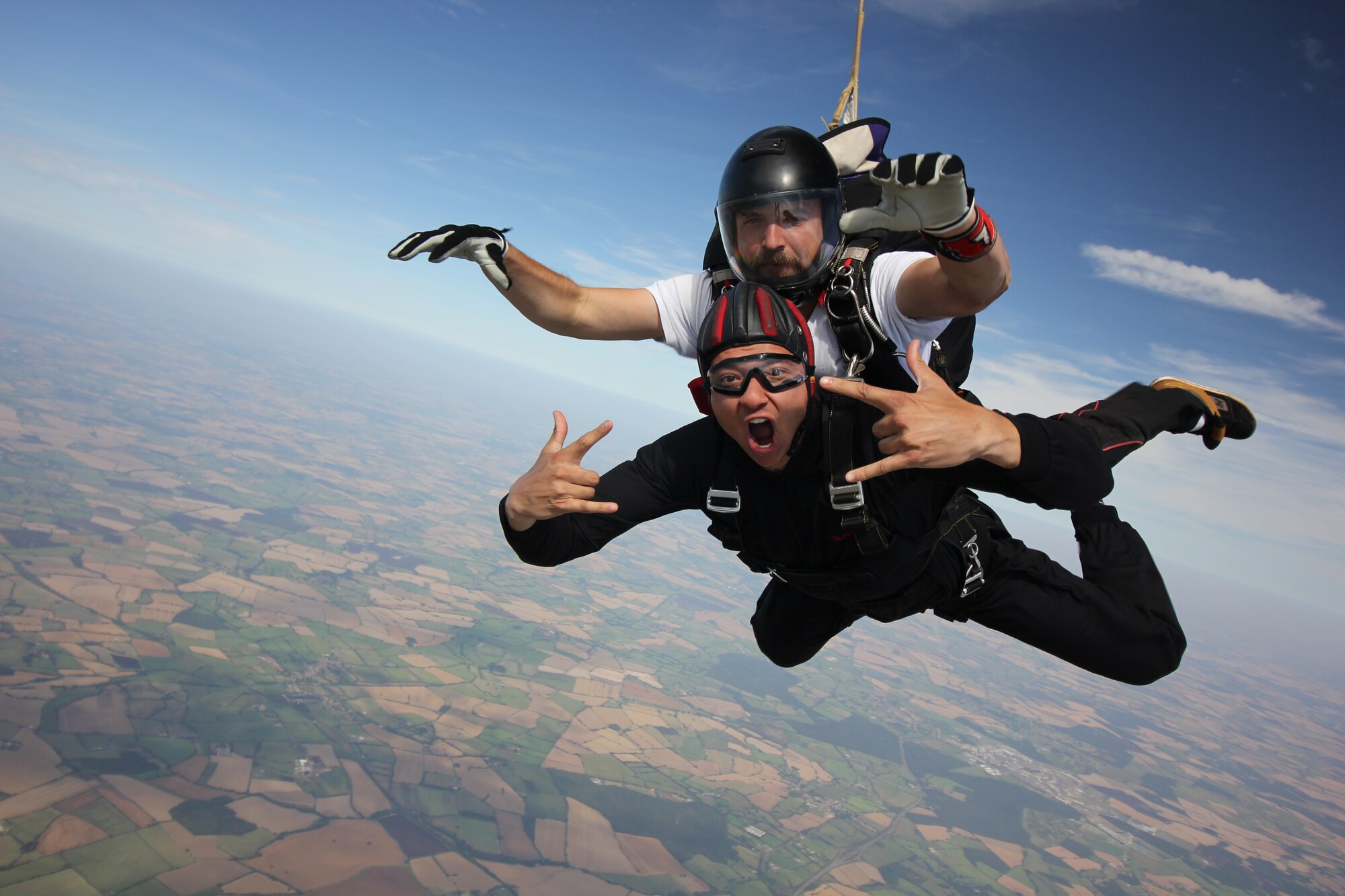 A servicemember from the 501st Combat Support Wing takes part in a tandem skydive as part of a Chapel-sponsored resiliency program. (Air Force Courtesy Photo)