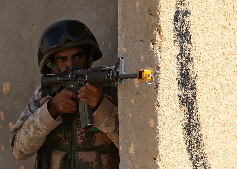 A Royal Jordanian Army soldier from the 39th Mechanized Infantry Battalion provides security for other Jordanian and U.S. Army soldiers as he scans for simulated enemy threats inside an urban assault training village near Amman, Jordan, Sept. 2, 2019. Jordanian soldiers were partnered with U.S. troops from 3rd Armored Brigade Combat Team, 4th Infantry Division, for a situational training exercise, part of Eager Lion 2019.