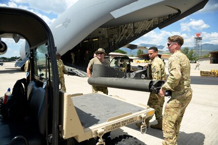 Soldiers from the 1st Battalion 228th Aviation Regiment place part of the wing assembly from a broken UH-60 Blackhawk onto a forklift after removing it from a C-17 Globemaster III, Aug 26, 2019, at Soto Cano Air Base, Honduras. During a mission to support the USNS Comfort, the UH-60 crew performed a precautionary landing in an austere environment in Costa Rica. After inspecting the Blackhawk, the crew determined that aircraft was not safe to fly. Joint service members from Joint Task Force - Bravo worked together, with the assistance of a C-17 Globemaster III from U.S. Transportation Command, to return the broken helicopter back to Soto Cano. (U.S. Army photo by Martin Chahin)