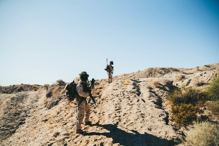 U.S. Marines with Company K, 3rd Battalion, 7th Marine Regiment, 1st Marine Division conduct a security patrol during company led training at Marine Corps Air Ground Combat Center (MCAGCC), Twentynine Palms, Calif., July 18, 2019. MCAGCC’s training areas provided an opportunity for the unit to bolster their combat capabilities in a desert environment in preparation for potential global contingencies. (U.S. Marine Corps Photo By Lance Cpl. William Chockey)