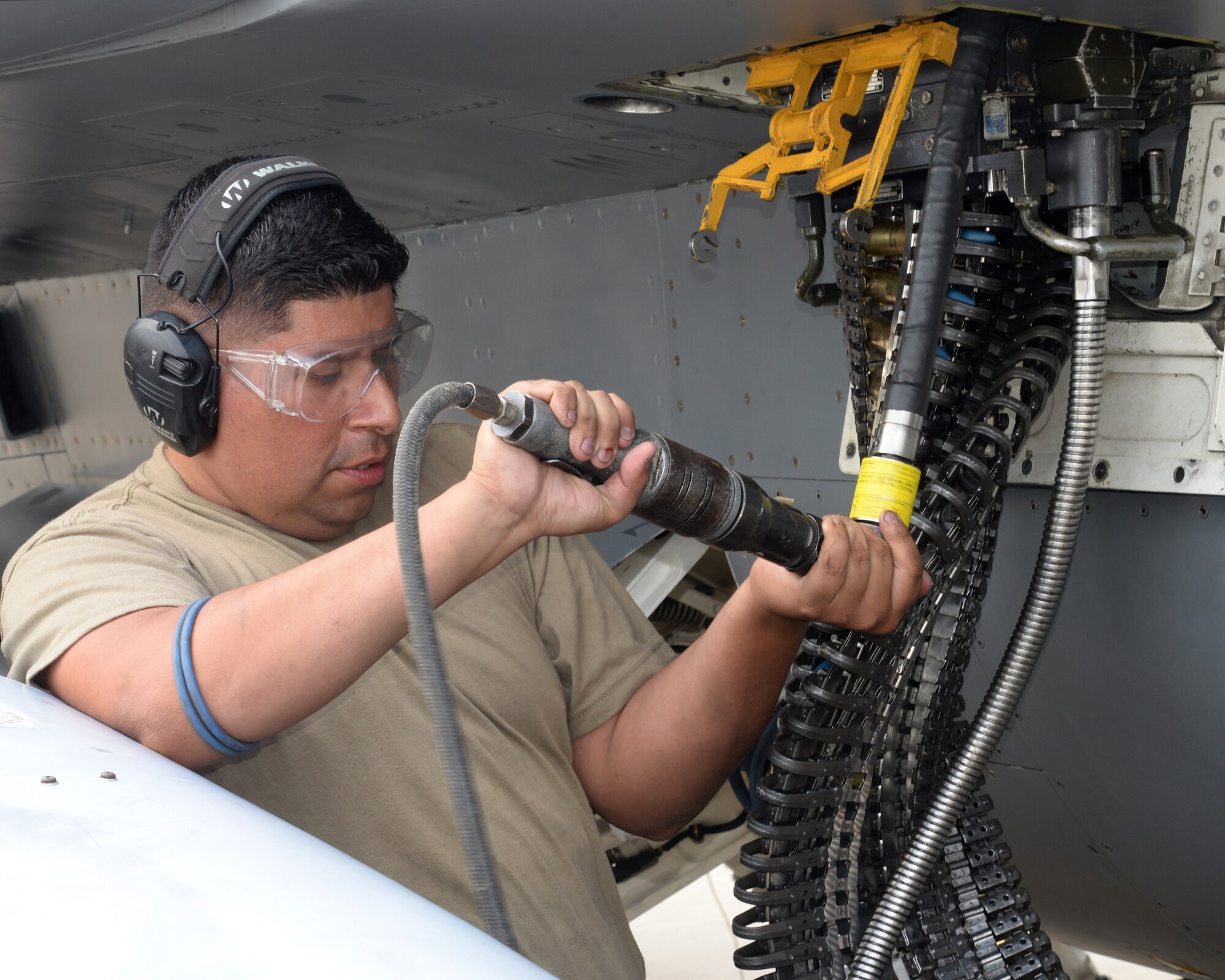 A picture of U.S. Air Force Staff Sgt. Daniel Umana, weapons loader with the New Jersey Air National Guard's 177th Fighter Wing, working on a 177Fw F-16C Fighting Falcon.