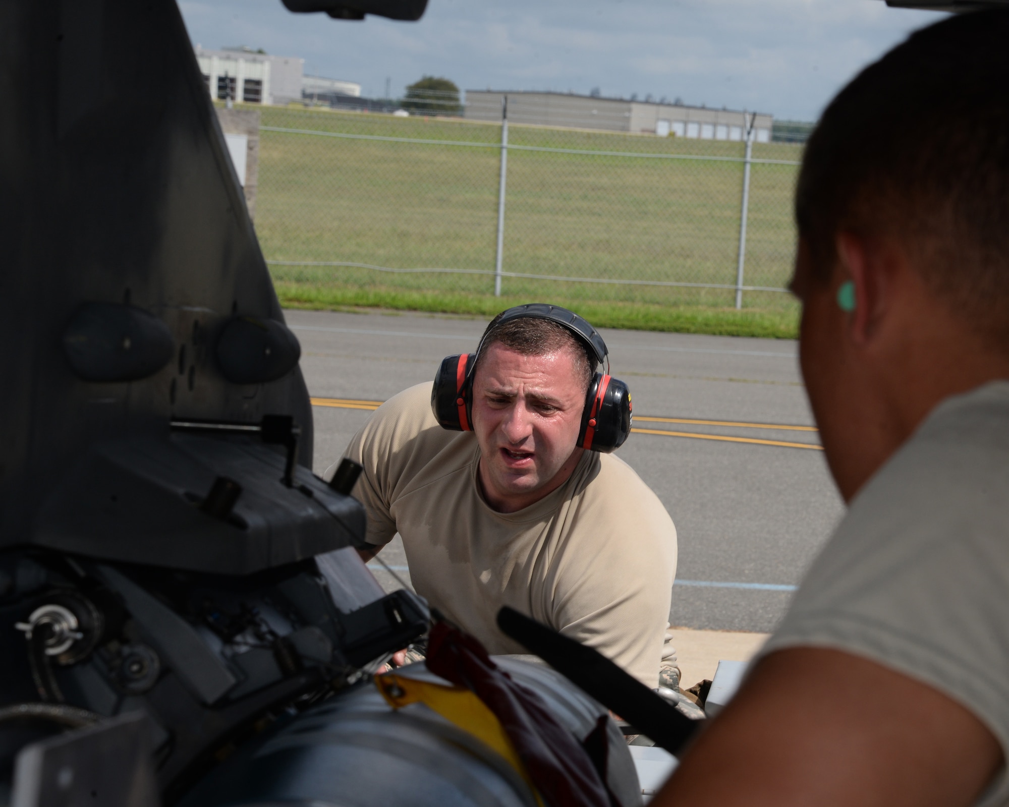 A picture of U.S. Air Force Senior Airman Michael Ward and Staff Sgt. Daniel Umana, weapons loaders with the New Jersey Air National Guard's 177th Fighter Wing, working of a 177FW F-16C Fighting Falcon.