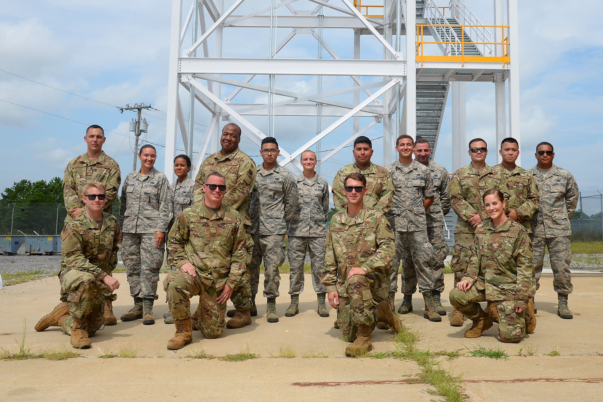 A picture of Members of four teams from the 177th Fighter Wing's inaugural Combined Combat Skills Challenge posing for a group photo at the Warren Grove Bombing Range in Ocean County, N.J.