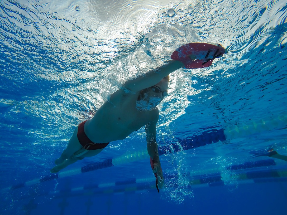 Jamie Brown, U.S. Paratriathlon National Team elite paralympic athlete, swims laps at the pool Aug 13, 2019, on Kadena Air Base, Japan. Brown’s biggest challenge is overtraining, which he relies on his team and support system to help him balance. (U.S. Air Force photo by Senior Airman Cynthia Belío)