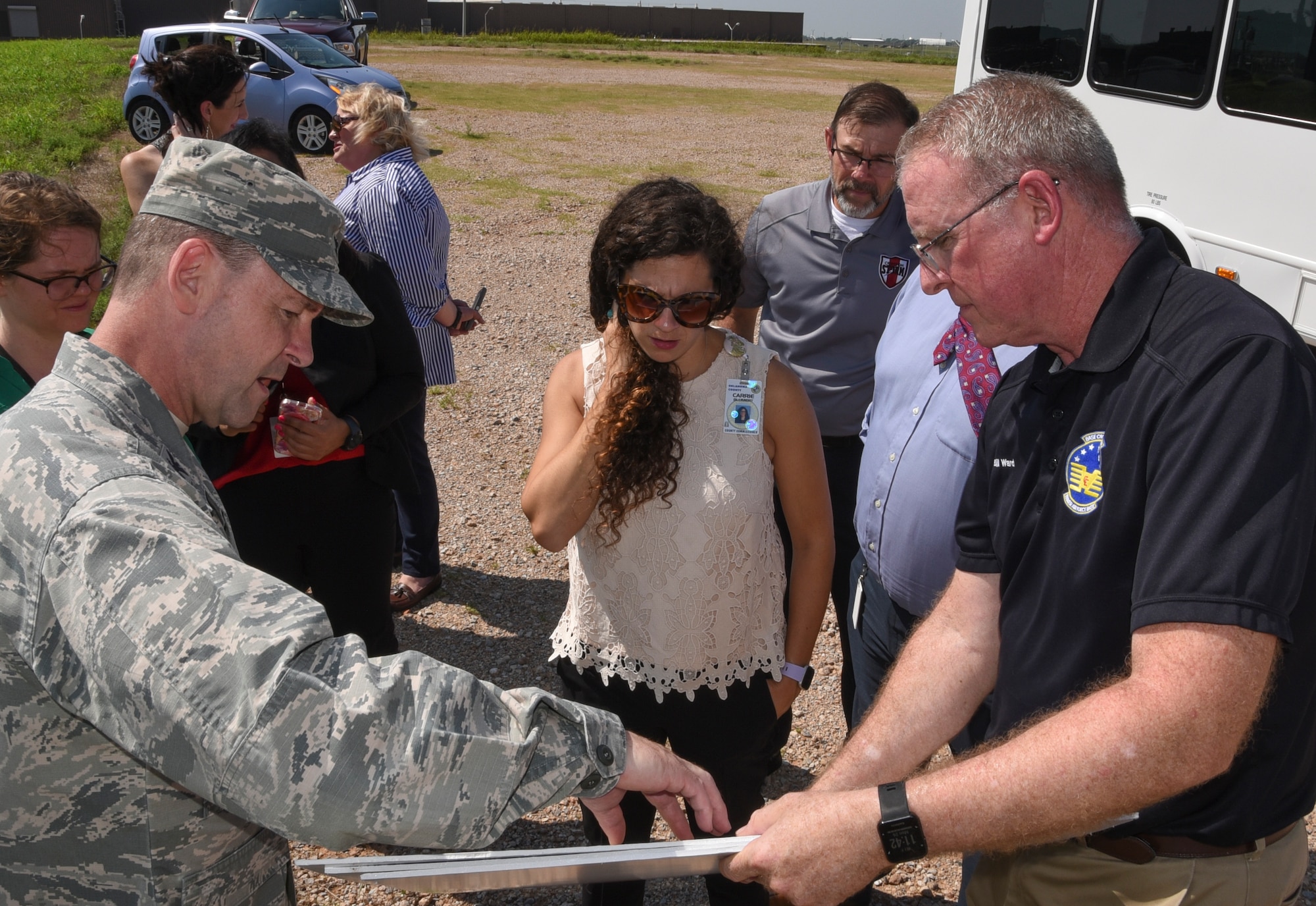 The Honorable Carrie Blumert, Oklahoma County Commissioner District 1, center, is briefed by Col. Paul Filcek, 72nd Air Base Wing commander, left, and Bill Ward, 72nd Civil Engineer Directorate, right, on construction progress of hangars for the KC-46A Pegasus tanker during a visit to Tinker Air Force Base, Oklahoma, August 26, 2019. Blumert and her staff visited Team Tinker to receive an overview of the Air Force Sustainment Center and how global logistics and the sustainment mission support the Air Force and also toured the KC-135 programmed depot maintenance line, the 76th Software Maintenance Group, the REACT Lab and the 552nd Air Control Wing. (U.S. Air Force photo/Greg L. Davis)