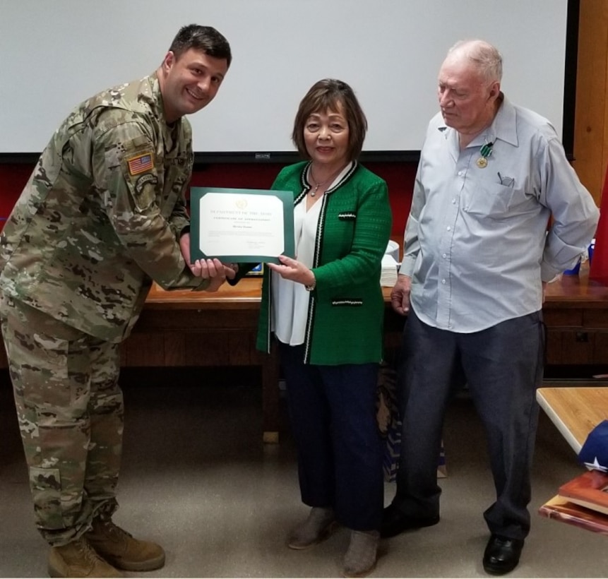 Deputy District Commander Lt. Col. Nathan Molica presents Mrs. Hamm with her Certificate of Appreciation.