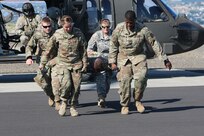 Soldiers with the 16th Combat Aviation Brigade provide medevac training to Illinois Army National Guard Soldiers from the 1844th Transportation Company as part of Rising Thunder 2019 at Yakima Training Center in Yakima, Washington,
