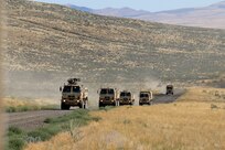 Illinois Army National Guard Soldiers from the 1844th Transportation Company convoy to their IED lane training as part of Rising Thunder 2019