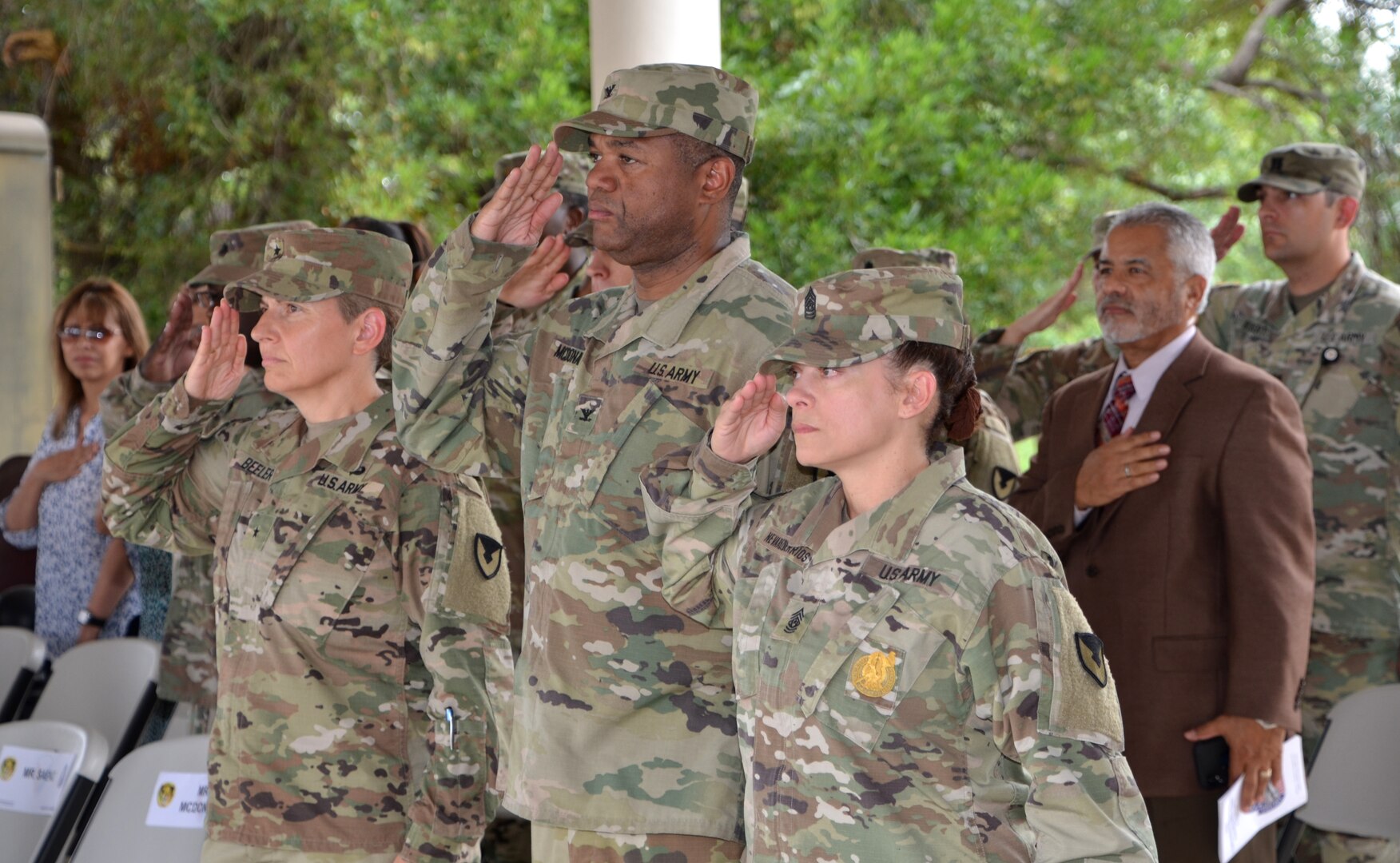 (From left) Brig. Gen. Christine Beeler, Col. Robert McDonald and Command Sgt. Maj. Sol Nevarezberrios render honors during the 410th Contracting Support Brigade uncasing ceremony Sept. 5 at Joint Base San Antonio-Fort Sam Houston following the brigade’s return from a nine-month deployment to Afghanistan. Beeler, the commanding general for the Mission and Installation Contracting Command, officiated the ceremony. McDonald is the 410th CSB commander and Nevarezberrios is the brigade command sergeant major.