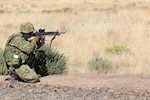 A soldier from the Japan Ground Self-Defense Force opens fire on his target in a live fire exercise during Rising Thunder, Sep. 1, at the Yakima Training Center in Yakima, Washington.