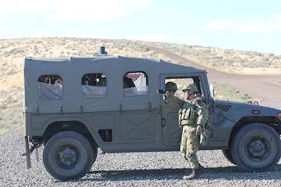 A Japanese infantryman gives a directional hand signal to his driver, Sept. 2, while on Range 15 at Yakima Training Center, during exercise Rising Thunder 19.