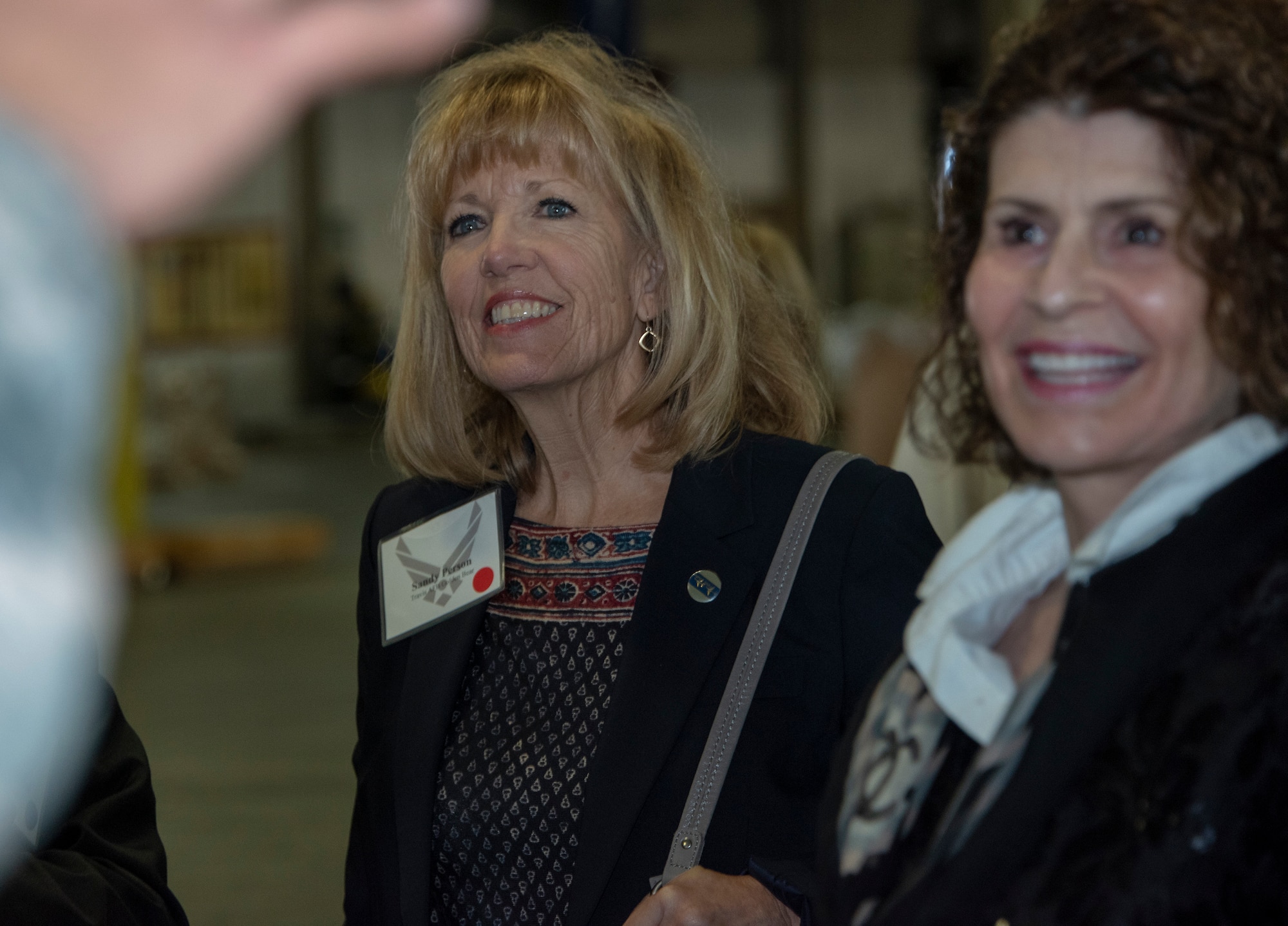 Sandy Person, left, Air Force-level civic leader, and Heidi Campini, 60th Medical Support Squadron honorary commander, participate in a tour through the 60th Aerial Port Squadron warehouse Oct. 12, 2018, Travis Air Force Base, California. Civic leaders and honorary commanders tour the base quarterly to promote relationships with Team Travis leadership, and communicate mutual interest, challenges and concerns. (U.S. Air Force Photo by Heide Couch)