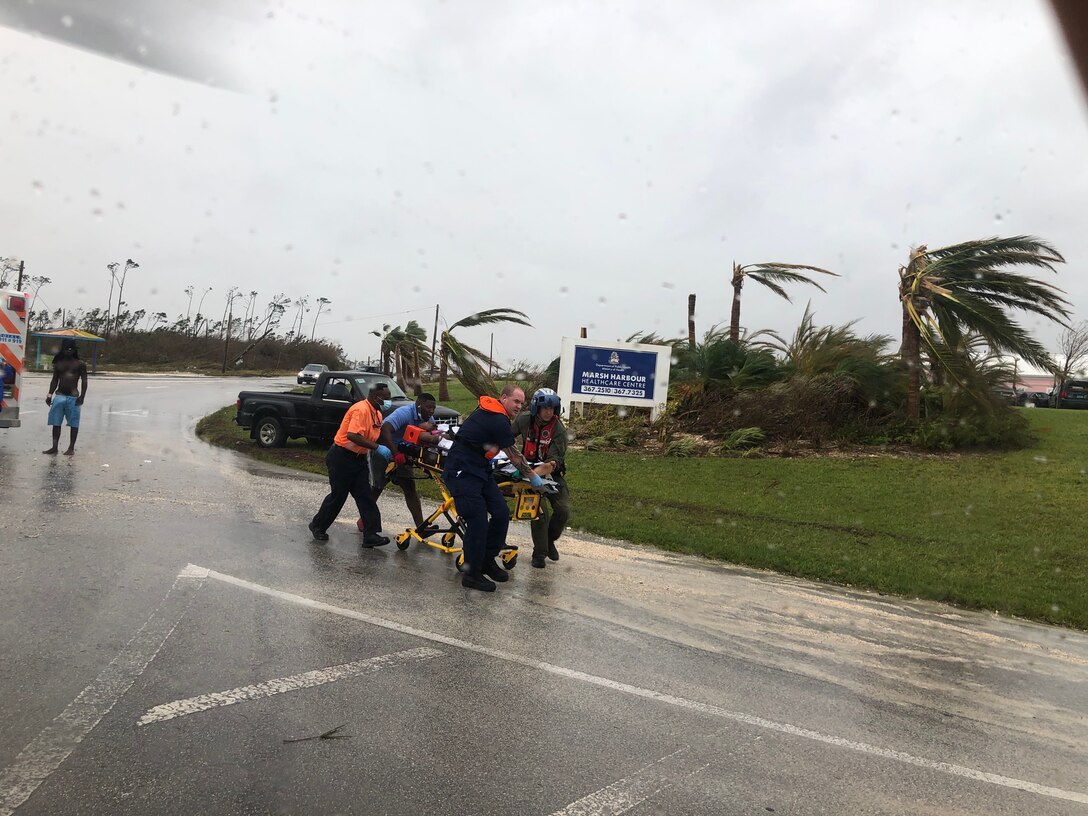 Coast Guard personnel help medevac a patient in the Bahamas during Hurricane Dorian.