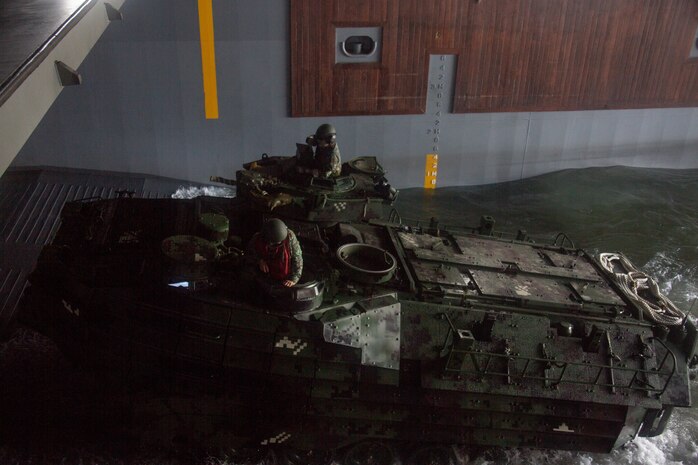 Philippine and U.S. Marines drive a Philippine assault amphibious vehicle onto the BRP Davao Del Sur (LD-602) during an AAV subject matter expert exchange in Subic Bay, Philippines, Aug. 31, 2019. The U.S. Marine Corps has partnered with the Philippine Marine Corps for the last eight years to develop skill sets and policies to enable the Philippine Navy and Marine Corps to conduct amphibious operations. This SMEE was a milestone in these efforts, marking the first time that Philippine forces launched their AAVs from a Philippine Navy amphibious ship and transited from ship to shore. The U.S. Marines are from AAV Company, 4th Marine Regiment, 3rd Marine Division. (U.S. Marine Corps photos by Lance Cpl. Jacob Hancock)