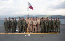 U.S. Marines pose with Philippine Marines for a celebratory end-of-training photo aboard the BRP Davao Del Sur (LD-602) during an assault amphibious vehicle subject matter expert exchange in Subic Bay, Philippines, Sept. 4, 2019. The U.S. Marine Corps has partnered with the Philippine Marine Corps for the last eight years to develop skill sets and policies to enable the Philippine Navy and Marine Corps to conduct amphibious operations. This SMEE was a milestone in these efforts, marking the first time that Philippine forces launched their AAVs from a Philippine Navy amphibious ship and transited from ship to shore. The U.S. Marines are from AAV Company, 4th Marine Regiment, 3rd Marine Division. (U.S. Marine Corps photos by Lance Cpl. Jacob Hancock)