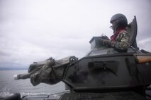 Philippine Marine Corps 1st Lt. Marever Taghap sits in the turret of an assault amphibious vehicle that is being driven by U.S. Marines during an AAV subject matter expert exchange in Subic Bay, Philippines, Sept. 1, 2019. The U.S. Marine Corps has partnered with the Philippine Marine Corps for the last eight years to develop skill sets and policies to enable the Philippine Navy and Marine Corps to conduct amphibious operations. This SMEE was a milestone in these efforts, marking the first time that Philippine forces launched their AAVs from a Philippine Navy amphibious ship and transited from ship to shore. The U.S. Marines are from AAV Company, 4th Marine Regiment, 3rd Marine Division. (U.S. Marine Corps photos by Lance Cpl. Jacob Hancock)