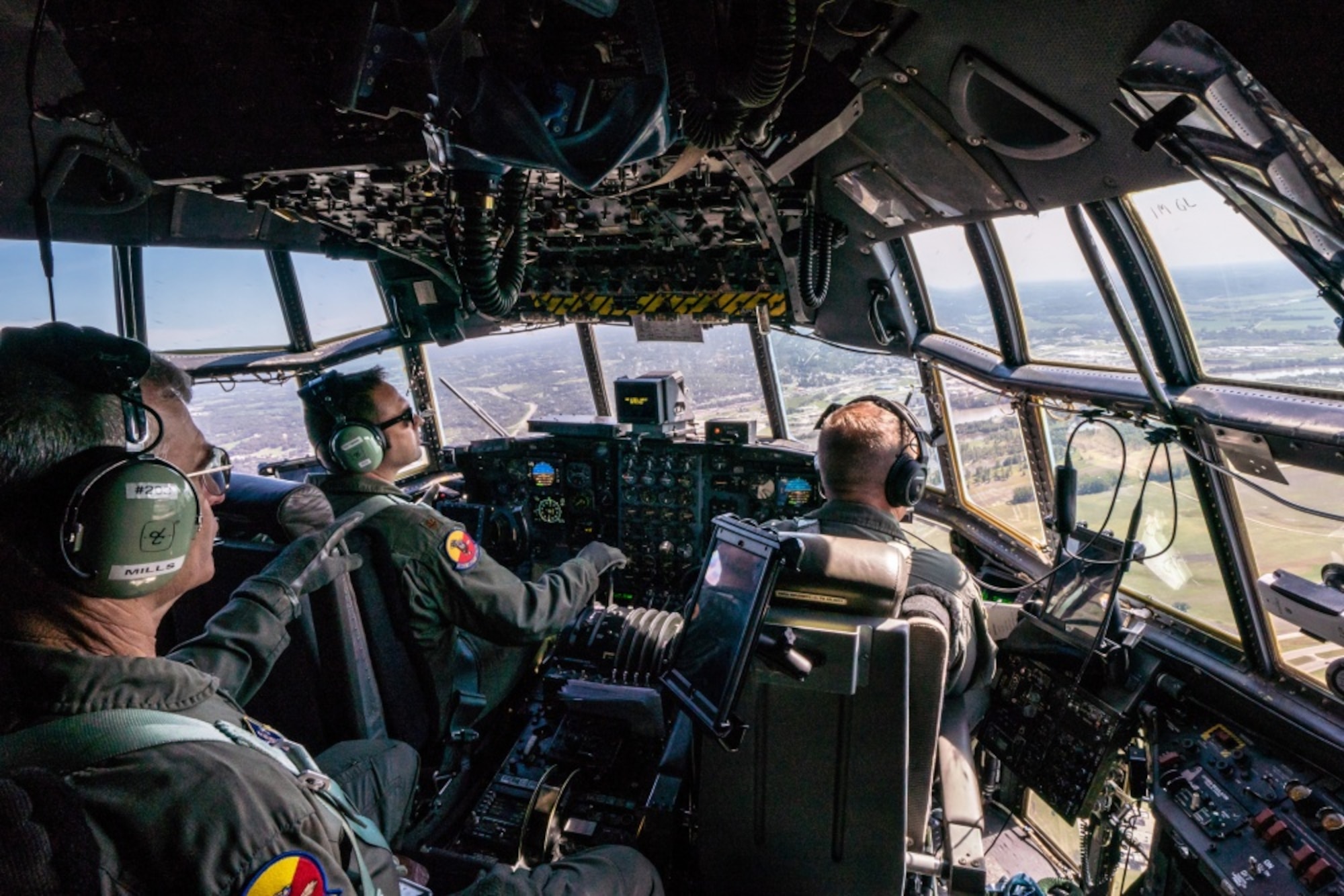U.S. Air Force Maj. Ed Fattmann, center, a pilot assigned to the 180th Airlift Squadron, Missouri Air National Guard, takes his first flight as an aircraft commander with one eye above St. Joseph, Missouri, Sept. 4, 2019. Fattman has been a pilot with the 180th AS since 2009, but was put on ‘duty not including flying’ status after losing sight in his right eye from a firework misfire in 2012. For his first flight back in military status, he flew with his original crew from his first deployment to Afghanistan in 2010. (U.S. Air National Guard photo by Tech. Sgt. Patrick Evenson)