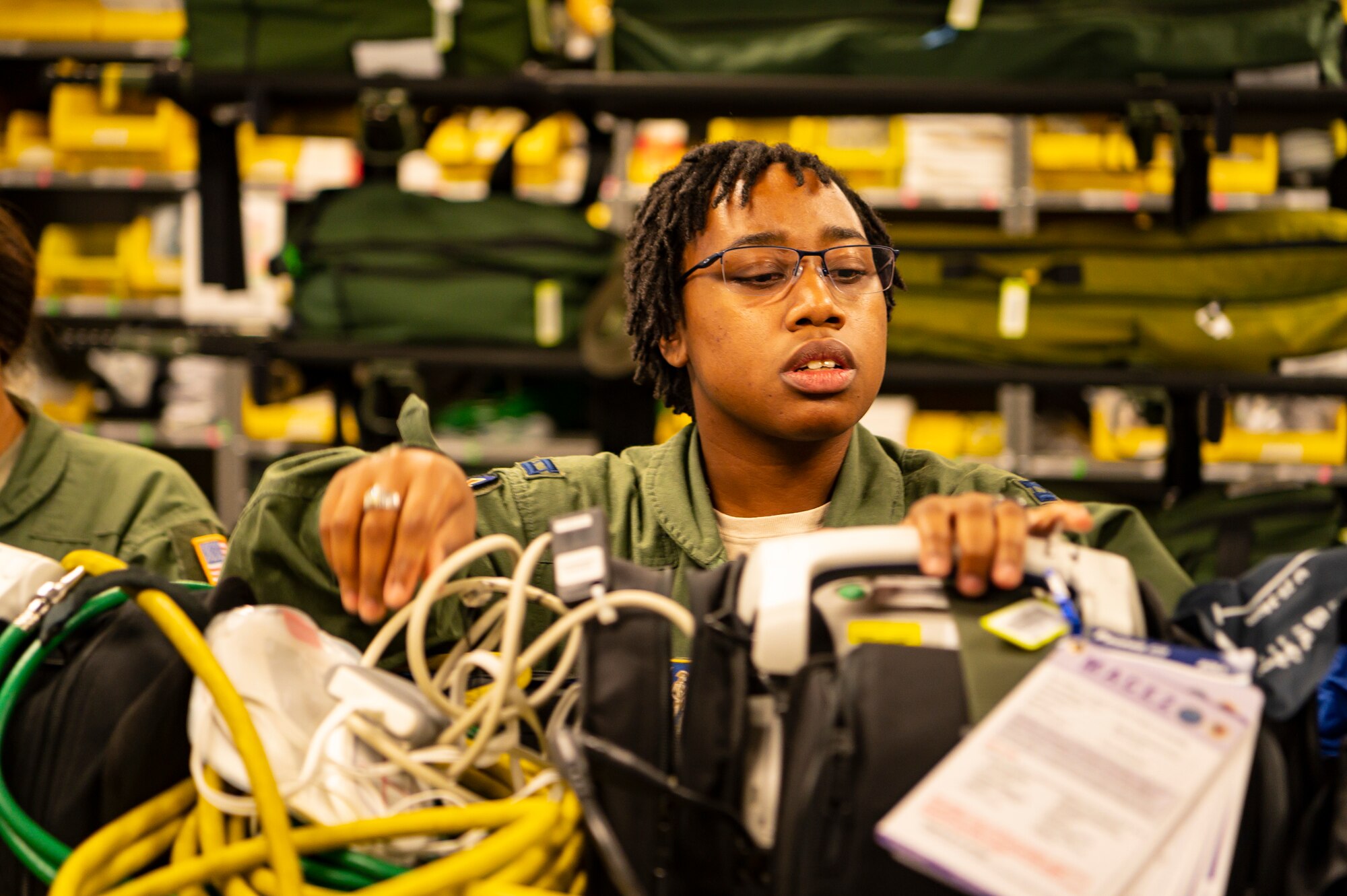 U.S. Air Force Capt. C.J. Adams, a flight nurse assigned to the 167th Aeromedical Evacuation Squadron, performs a medical equipment function check prior to mobilizing in support of Hurricane Dorian relief, Sept. 5, 2019, at McLaughlin Air National Guard Base, Charleston, West Virginia. The West Virginia Air National Guard will be providing a crew of six aeromedical evacuation technicians and flight nurses to assist with hurricane response efforts in affected areas throughout the United States and in the Bahamas. (U.S. Air National Guard photo by Master Sgt. De-Juan Haley)