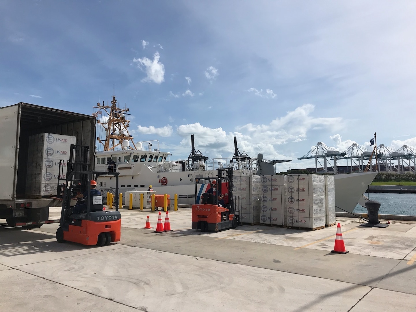 Coast Guard cutters at Coast Guard Sector Miami onload hurricane relief supplies to take to the Bahamas.