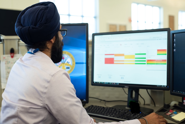 Manveer Singh Khanijoun, a business data analyst with Business Practices at the U.S. Army Engineering and Support Center, Huntsville, Alabama, navigates a Qlik Sense dashboard Aug. 28, 2019, as part of Huntsville Center’s push to incorporate data analytics, visualization and automation into its everyday processes.