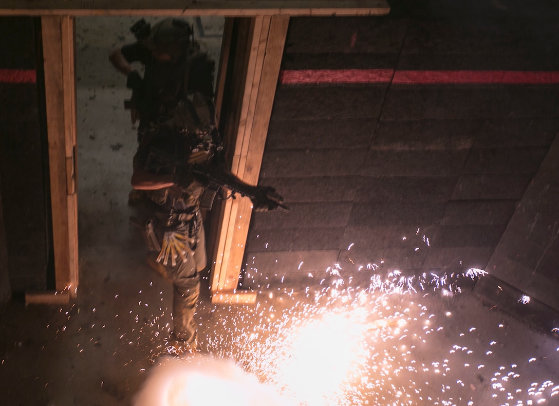 U.S. Marines with 3rd Reconnaissance Battalion, 3rd Marine Division, participate in a close quarters tactics exercise on Camp Hansen, Okinawa, Japan, Aug. 28, 2019. The close quarters tactics training requires these Marines to move quickly between their target building and the UH-60 Seahawk helicopter for extraction. This training helps them maintain their overall readiness and lethality.