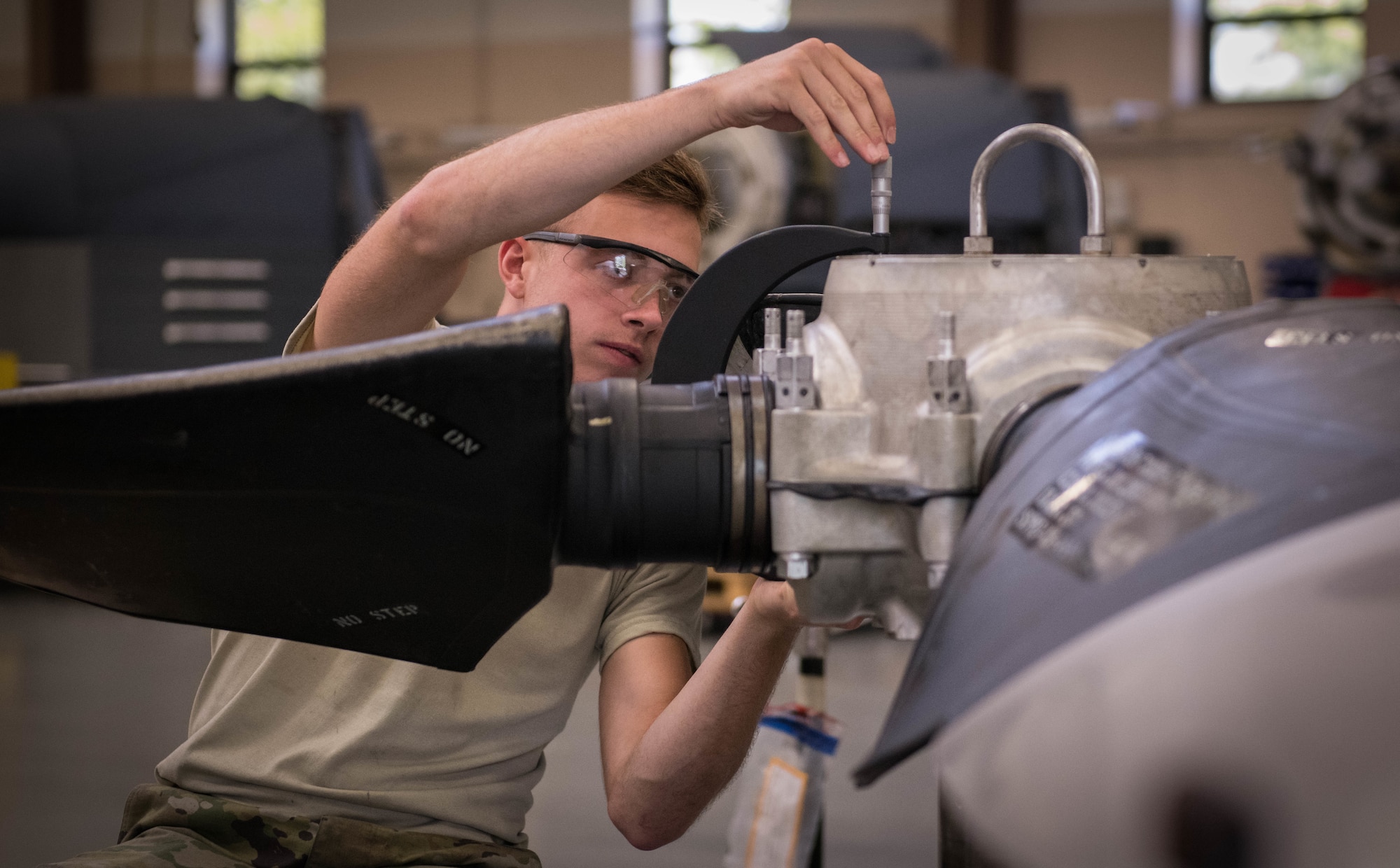 Senior Airman Sean Kenny, an aerospace propulsion technician assigned to the the 910th Maintenance Squadron, assembles the hub and blades on a test post, Aug. 11, 2019 at Youngstown Air Reserve Station.