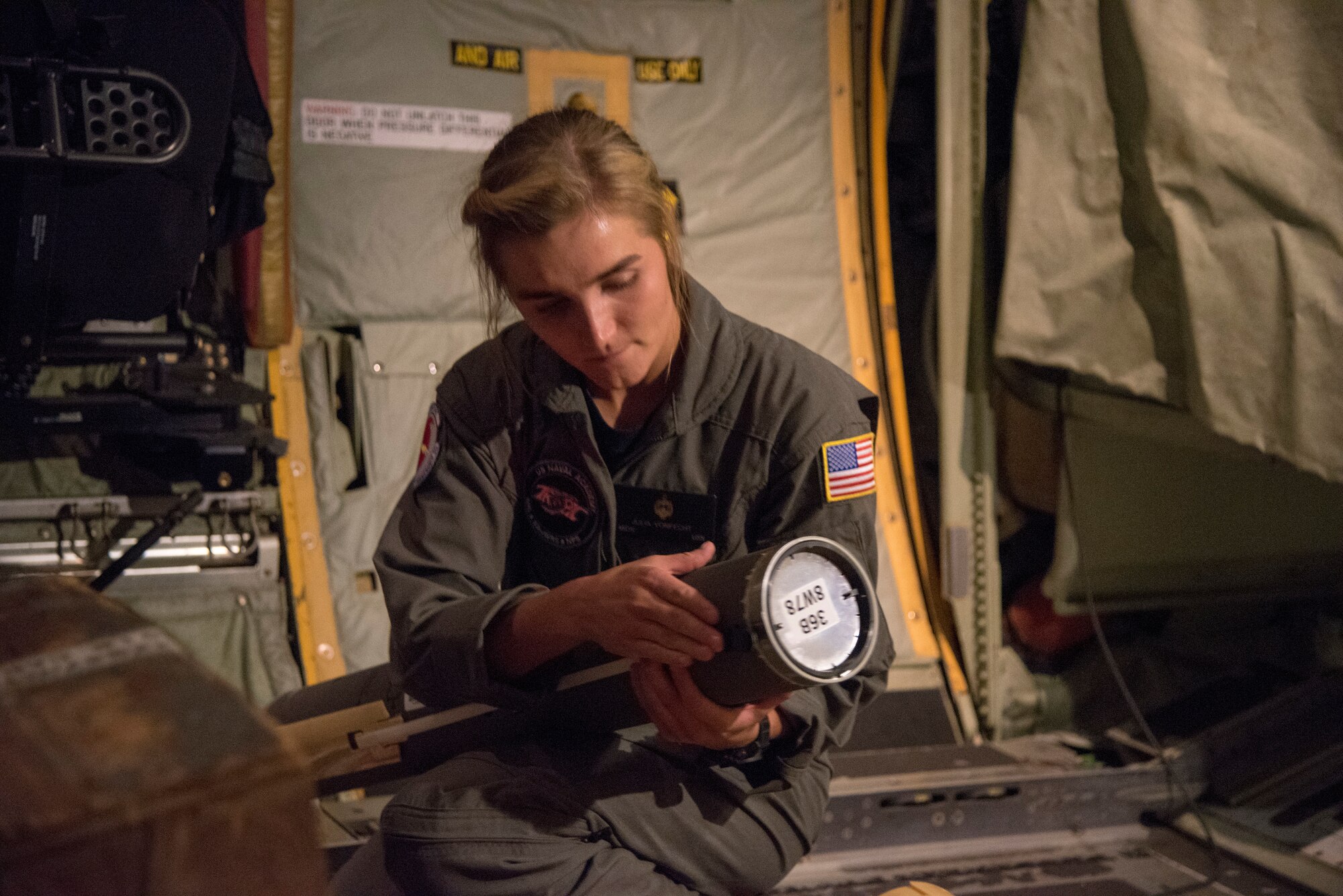 U.S. Naval Academy Midshipman First Class Julia Von Fecht, Training and Research in Oceanic and Atmospheric Processes in Tropical Cyclones Program team member, prepares a Navy Airborne Expendable Bathythermographs for deployment from a WC-130J Super Hercules during a Hurricane Hunter mission into Hurricane Dorian Aug. 31, 2019 over the Atlantic Ocean.