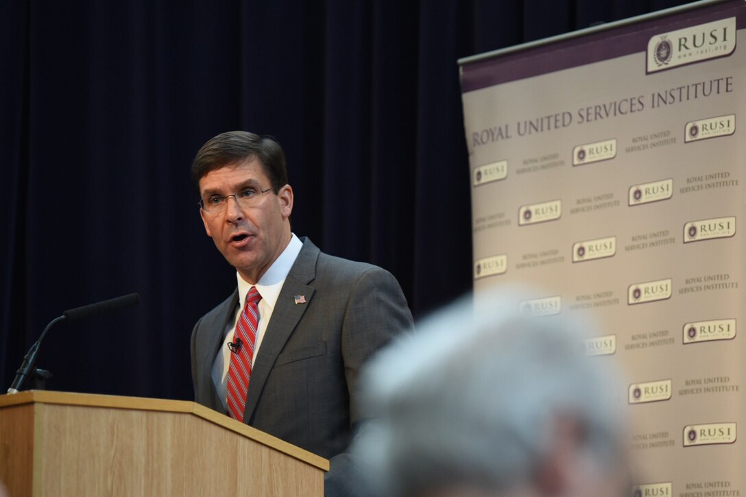 Defense Secretary Dr. Mark T. Esper speaks at a lectern.