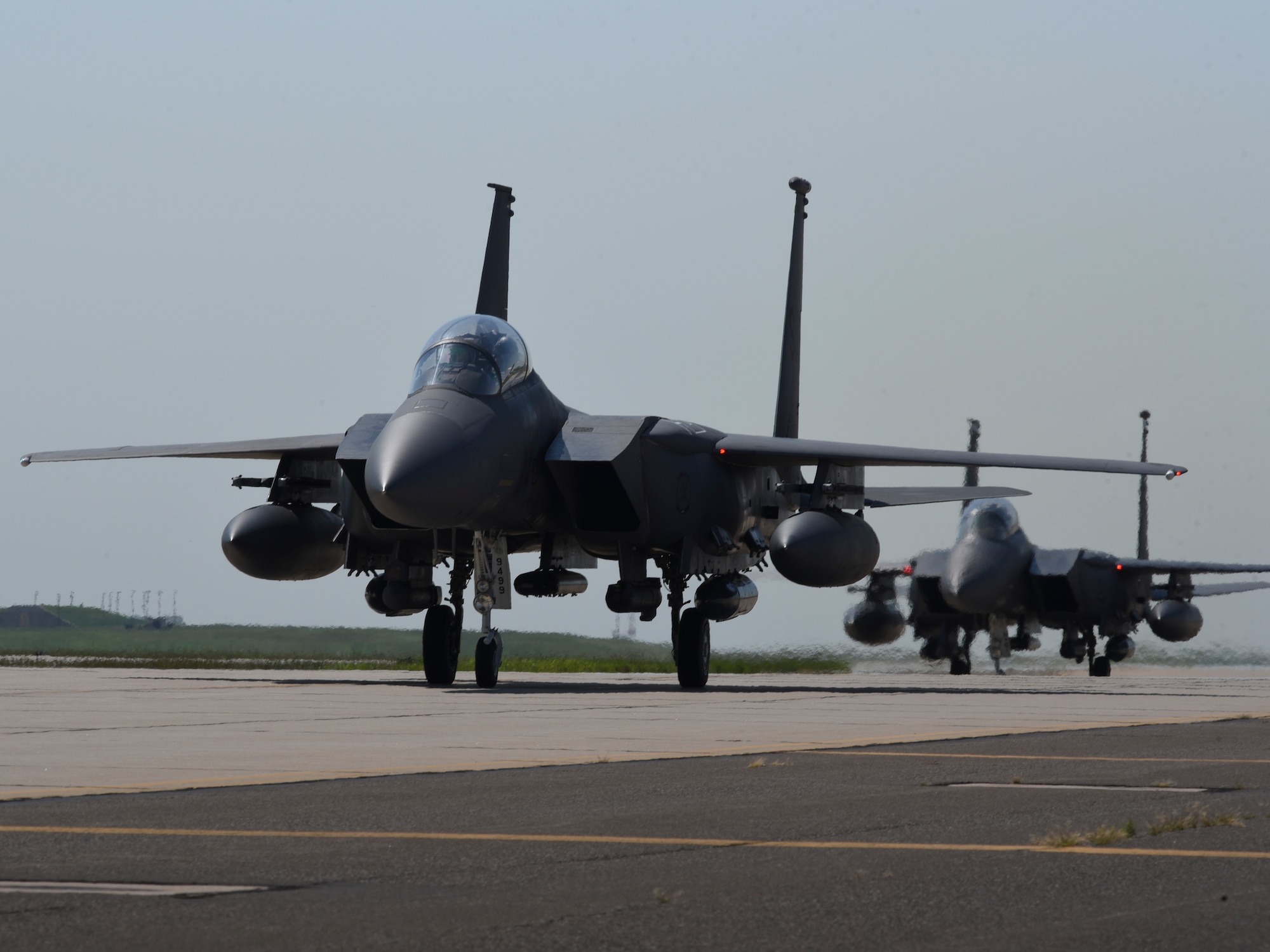 Three F-15E Strike Eagle aircraft from the 4th Fighter Wing, Seymour-Johnson Air Force Base, North Carolina, taxi at Tinker AFB, Oklahoma as part of a mass-relocation of vulnerable aircraft to escape Hurricane Dorian's path Sept. 4, 2019, Tinker AFB, Oklahoma. Team Tinker executed an existing agreement with Seymour-Johnson AFB, North Carolina and Warner-Robins AFB, Georgia to host fighters, tankers and reconnaissance aircraft far away from the devastating hurricane currently impacting the East Coast of the United States. (U.S. Air Force photo/Greg L. Davis)