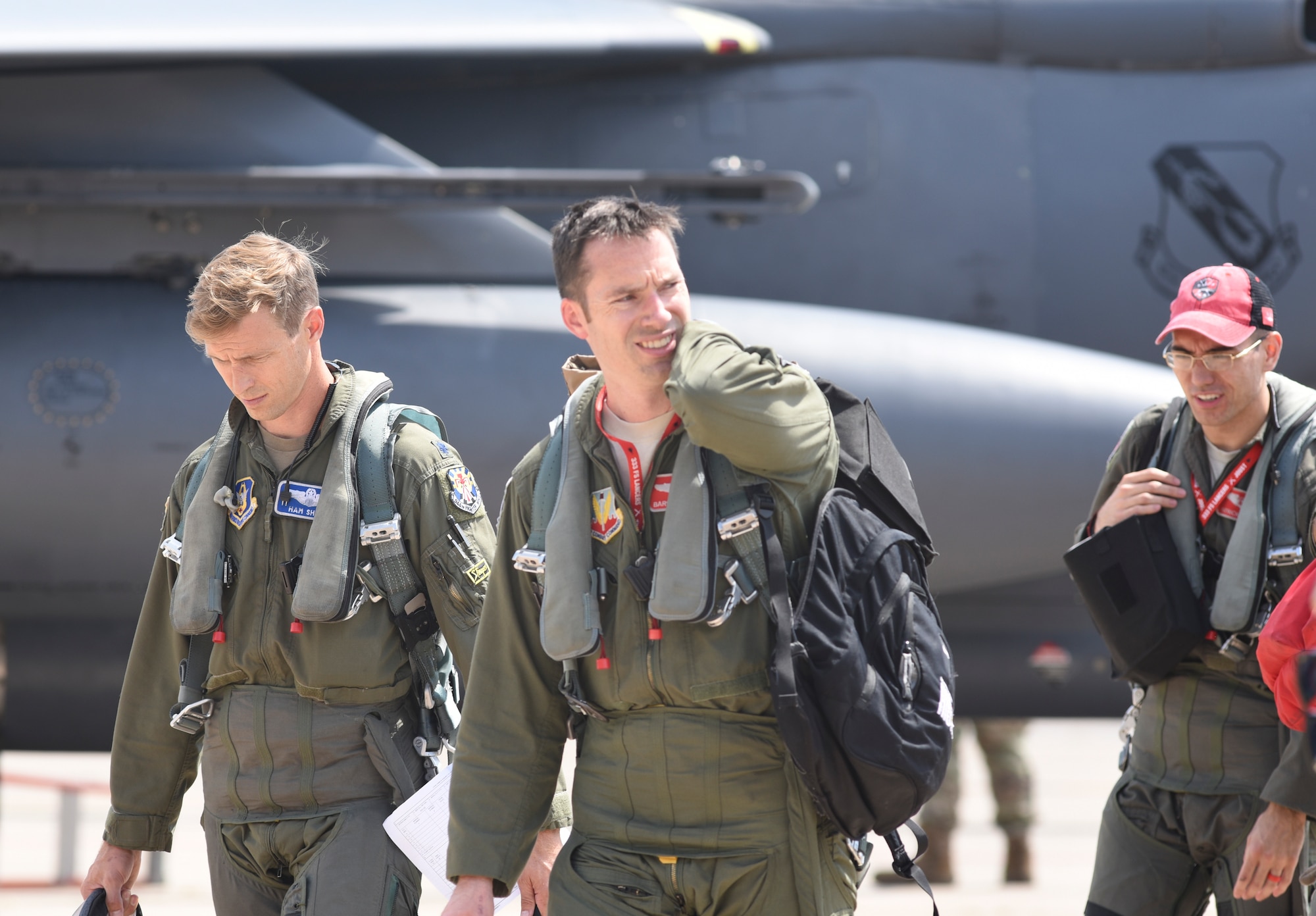 F-15E Strike Eagle aircrew from the 4th Fighter Wing, Seymour-Johnson Air Force Base, North Carolina, walk from the flight line after arriving at Tinker AFB, Oklahoma as part of a mass-relocation of vulnerable aircraft to escape Hurricane Dorian's path Sept. 4, 2019, Tinker AFB, Oklahoma. Team Tinker executed an existing agreement with Seymour-Johnson AFB, North Carolina and Warner-Robins AFB, Georgia to host fighters, tankers and reconnaissance aircraft far away from the devastating hurricane currently impacting the East Coast of the United States. (U.S. Air Force photo/Greg L. Davis)
