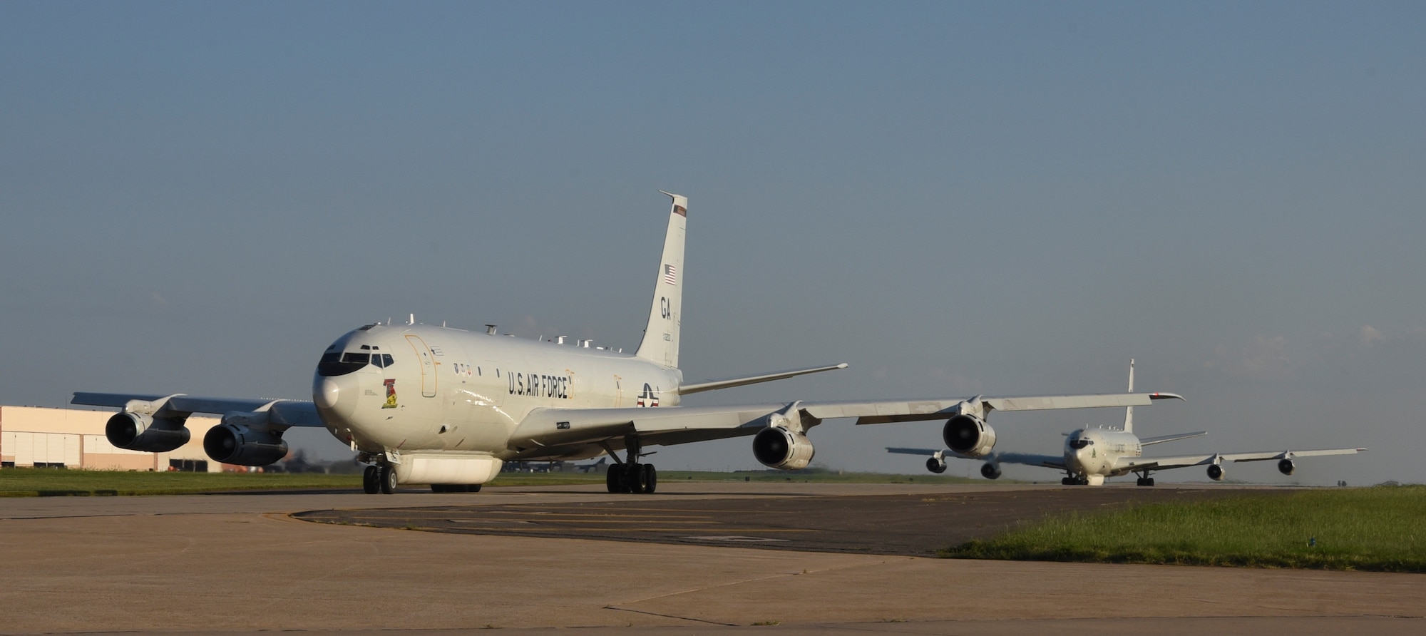 Two E-8C Joint Stand-Off Aerial Reconnaissance System aircraft from the 116th Air Control Wing, Georgia Air National Guard, taxi toward the runway at Tinker AFB, Oklahoma for departure to home station Sept. 4, 2019, Tinker AFB, Oklahoma. Team Tinker executed an existing agreement with Seymour-Johnson AFB, North Carolina and Warner-Robins AFB, Georgia to host fighters, tankers and reconnaissance aircraft far away from the devastating hurricane currently impacting the East Coast of the United States. (U.S. Air Force photo/Greg L. Davis)