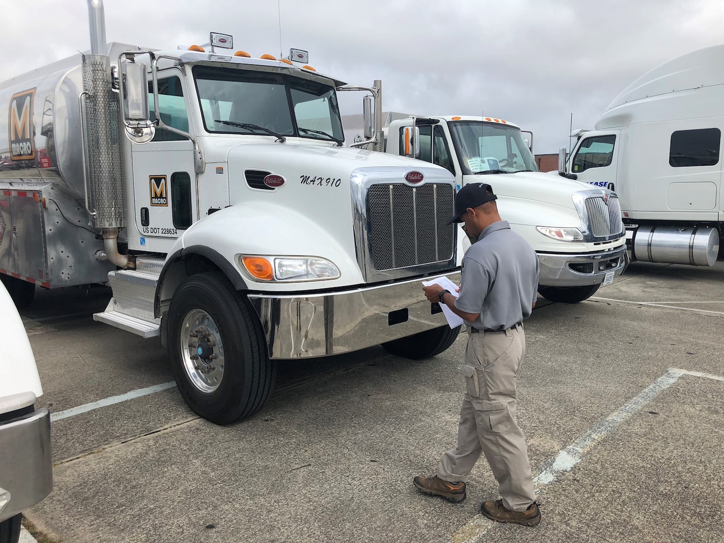 a man checks a fuel truck