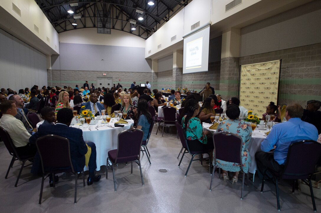 Attendees of the Valdosta City Schools (VCS) 2019 Teacher of the Year Banquet socialize before the program begins, Sept. 5, 2019, at the Rainwater Conference Center, Valdosta, Ga. This year the VCS system named Melvina Murray, Valdosta City Schools (VCS) Teacher of the Year award recipient and Team Moody spouse, as one of two recipients of the award to recognize her hard work and dedication before the Murray family relocates to California mid-September. Murray’s leadership describes her as a VCS educator who not only embodies her school’s core expectations of integrity first, respect for yourself and others, and excellence in all we do, but also consistently placed service before herself. (U.S. Air Force photo by 2nd Lt. Kaylin P. Hankerson)