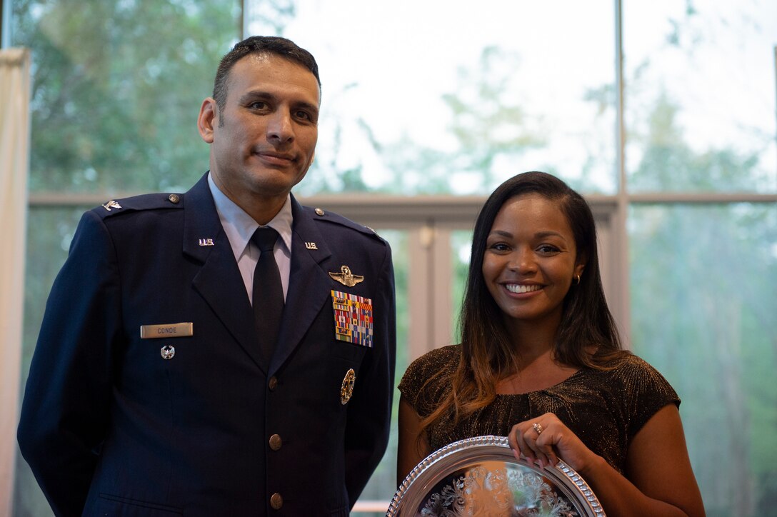Col. Benjamin Conde, left, 23d Wing vice commander, poses with Melvina Murray, Valdosta City Schools (VCS) 2019 Teacher of the Year Award recipient and Team Moody spouse, after the VCS 2019 Teacher of the Year Banquet Sept. 5, 2019, at the Rainwater Conference Center, Valdosta, Ga. Murray received the award for being the system’s educator who not only embodies her school’s core expectations of integrity first, respect for yourself and others, and excellence in all we do, but also consistently placed service before herself.  This year the VCS system named Murray as one of two recipients to recognize her hard work and dedication before the Murray family relocates to California mid-September. (U.S. Air Force photo by 2nd Lt. Kaylin P. Hankerson)