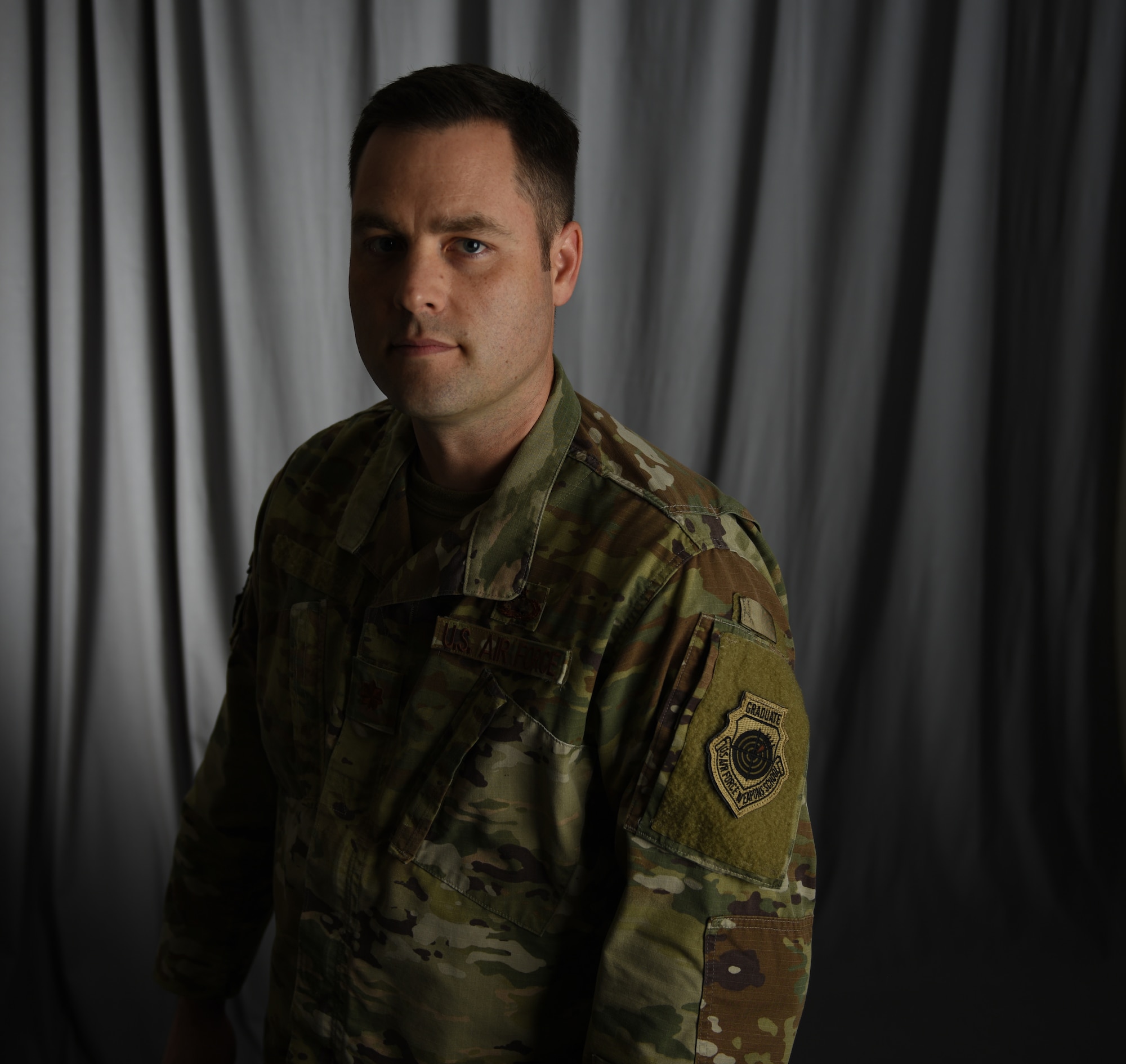 U.S. Air Force Maj. Ryan, a member of the 118th Wing, Tennessee Air National Guard, displays his Air Force Weapons School graduate patch Sept. 3, 2019 at Berry Field Air National Guard Base, Nashville, Tenn.