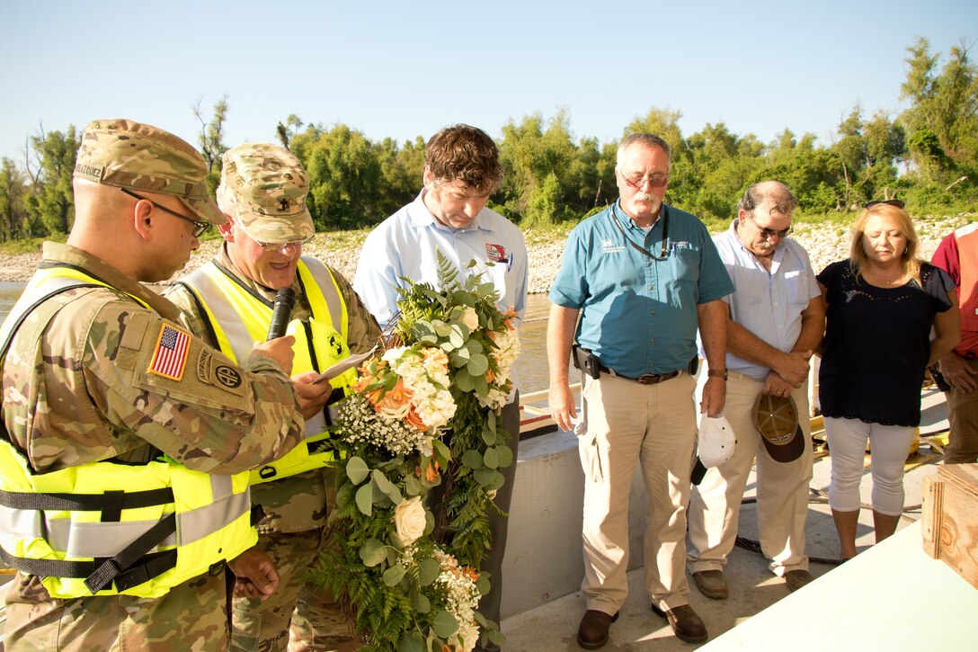 VICKSBURG, Miss. – The U.S. Army Corps of Engineers (USACE) Vicksburg District held a “Blessing of the Fleet” ceremony Sept. 4 to commemorate the deployment of the district’s Mat Sinking Unit and the official start of revetment season.

The ceremony was held at the Vicksburg District Harbor and included blessings from USACE Chaplain Col. Bradford Baumann, Rev. Sam Godfrey of Christ Episcopal Church and Rev. Carl Young, a crew member on the Mat Sinking Unit. Members of the Memphis District revetment team and representatives of the Mississippi Valley Division were also in attendance. District leadership, including Commander Col. Robert Hilliard and Chief of Operations Julie Vignes, spoke at the ceremony and emphasized the importance of the unit’s work.