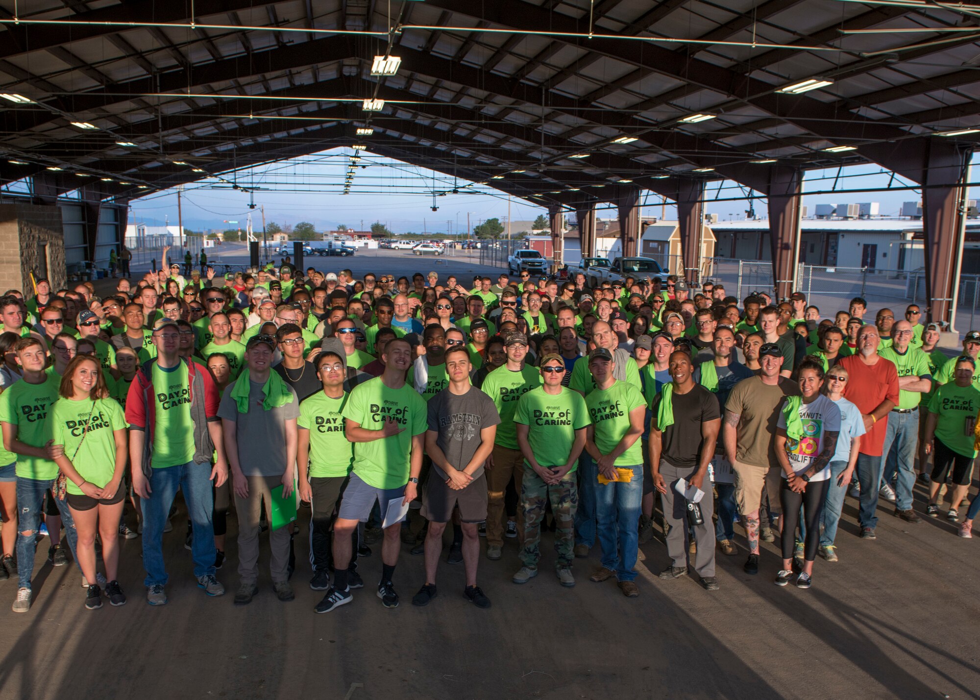 Volunteers from Holloman Air Force Base, N.M. and the local Otero County community pose a photo, Sept. 6, 2019, at the Otero County Fairgrounds in Alamogordo, N.M. Day of Caring volunteers performed various tasks, such as home repairs and yard work, at pre-determined job sites for individuals who are either unable to accomplish the tasks themselves or do not the resources to do so. (U.S. Air Force photo by Airman 1st Class Kindra Stewart)