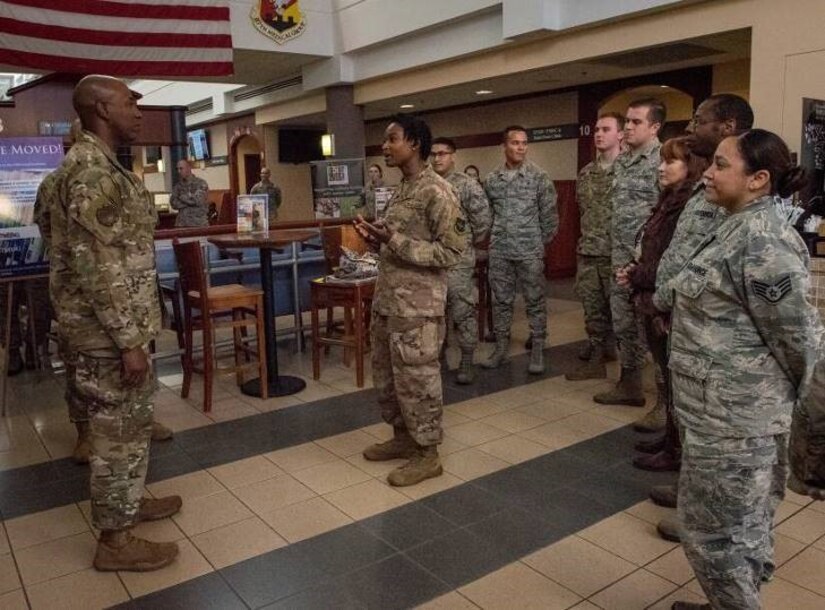 Senior Airman De’jhanicca Covington, from the 87th Medical Group, briefs Chief Master Sergeant of the Air Force Kaleth O. Wright during a base visit to Joint Base McGuire-Dix-Lakehurst, New Jersey, Sept. 5, 2019. During his visit, Wright spoke with Airmen from the Combined Maintenance Operations Facility, 87th Security Forces Squadron, and the 621st Contingency Response Wing and held an All Call.