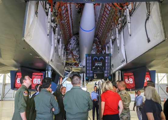 Lt. Col. Dominic Ross, B-1B program element monitor, Air Force Global Strike Command, explains a bulkhead modification to the B-1B bomber that allowed it to carry a notional hypersonic missile mock-up attached to a B-52H Conventional Rotary Launcher during a B-1B expanded carriage demonstration at Edwards Air Force Base, California, Aug. 28. (U.S. Air Force photo by Giancarlo Casem)