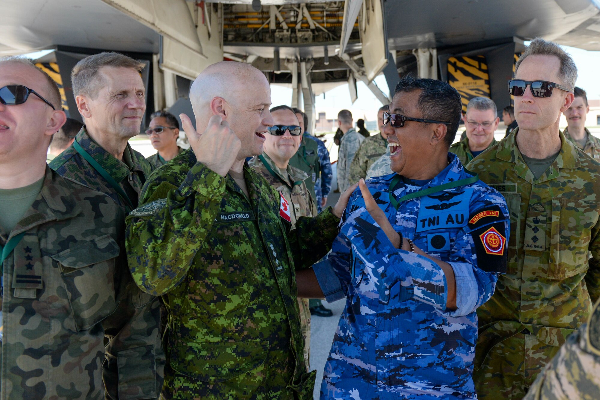 Foreign defense attachés enjoy a tour of a B-1B Lancer while visiting Ellsworth Air Force Base, S.D., Sept. 4, 2019. Approximately 45 defense attachés from several different countries came the base to learn more about the mission of the 28th Bomb Wing and the 89th Attack Squadron. They toured statics of munitions; a B-1, assigned to the 37th Bomb Squadron; and UH-72, which was provided by the South Dakota National Guard. (U.S. Air Force photo by Tech. Sgt. Jette Carr)