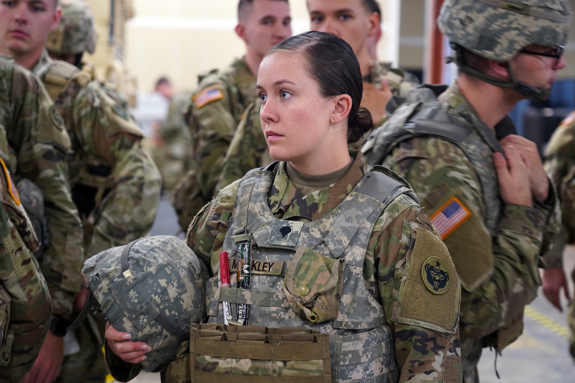 Specialist Teri Markley, a native of Benson, Ariz. assigned to the 98th Support Maintenance Company, 17th Combat Support Sustainment Battalion, U.S. Army Alaska, waits with fellow Soldiers to train with the Reconfigurable Vehicle Tactical Trainer on Joint Base Elmendorf-Richardson, Alaska, Sept. 5, 2019. The RVTT provides Soldiers the opportunity to shoot, move, and communicate while mounted in a virtual and controlled environment while taking advantage of customizable exercise scenarios tailored to their unit specific training objectives. (U.S. Air Force photo/Justin Connaher)