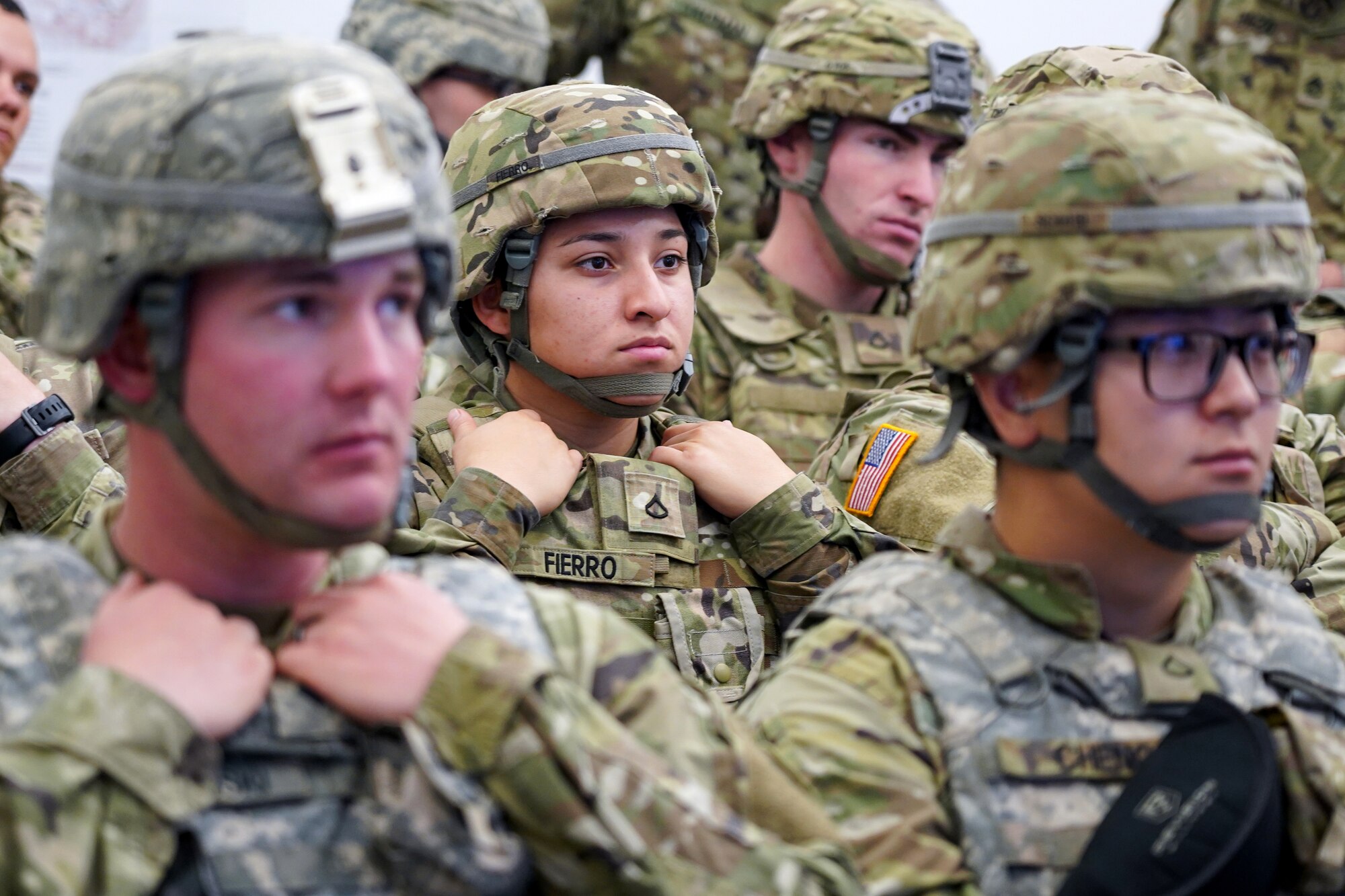 Army Pfc. Alyssa Fierro listens to a briefing with fellow Soldiers assigned to the 98th Support Maintenance Company, 17th Combat Support Sustainment Battalion, U.S. Army Alaska, before training with the Reconfigurable Vehicle Tactical Trainer on Joint Base Elmendorf-Richardson, Alaska, Sept. 5, 2019. The RVTT provides Soldiers the opportunity to shoot, move, and communicate while mounted in a virtual and controlled environment while taking advantage of customizable exercise scenarios tailored to their unit specific training objectives. (U.S. Air Force photo/Justin Connaher)
