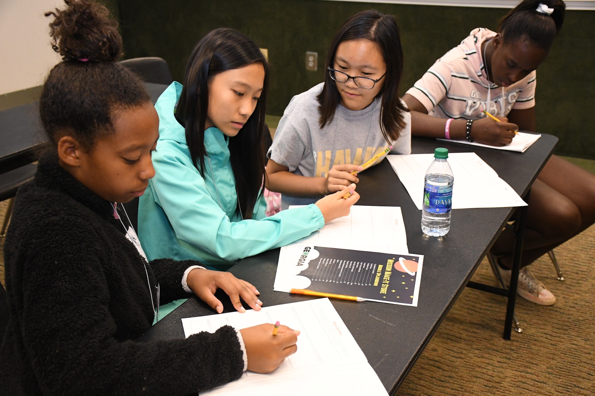 Four middle school female youth practice the engineering process to complete their space-focused mission at Rock Eagle 4-H Center in Eatonton, Ga., Aug 17, 2019.  The Air Force and space focused programming allowed youth to question and hear from Air Force personnel.    (U.S. Air Force photo by 1st Lt. Casey D. Mull)