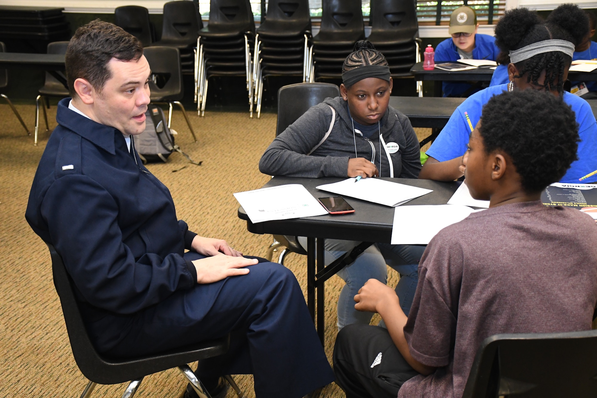 1st Lt. Alan Abernethy, public affairs chief at the 94th Airlift Wing, shares space weather information to assist youth in their space-focused mission at Rock Eagle 4-H Center in Eatonton, Ga., Aug 17, 2019.  The Air Force and space focused programming allowed youth to question and hear from Air Force personnel.    (U.S. Air Force photo by 1st Lt. Casey D. Mull)