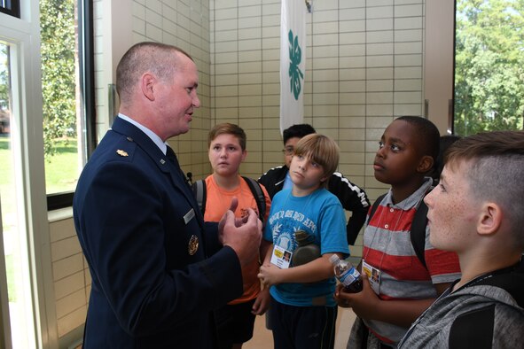 Youth ask questions of Maj. Benjamin Calhoon, 22nd Air Force executive officer, regarding his experience as a space operations officer at Rock Eagle 4-H Center in Eatonton, Ga., Aug 17, 2019. Maj. Calhoon served as capnote speaker for 4-H youth development event and shared opportunities for STEM related careers and space-related technology in the Air Force.