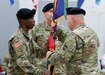 Command Sgt. Maj. Jon Zimmerman, the incoming command sergeant major, passes the U.S. Army Reserve’s 99th Readiness Division colors to 1st Sgt. Earl Morgan, the 99th Readiness Division Headquarters and Headquarters Company first sergeant, during a change of responsibility ceremony Sept. 7, 2019. The change of responsibility is a transition that is rich with symbolism and heritage, and serves the dual function of recognizing the enlisted service of the departing command sergeant major, and providing official recognition of the change of responsibility as senior noncommissioned officer to the incoming command sergeant major. (U.S. Army Reserve Photo by Sgt. Bethany L. Huff)