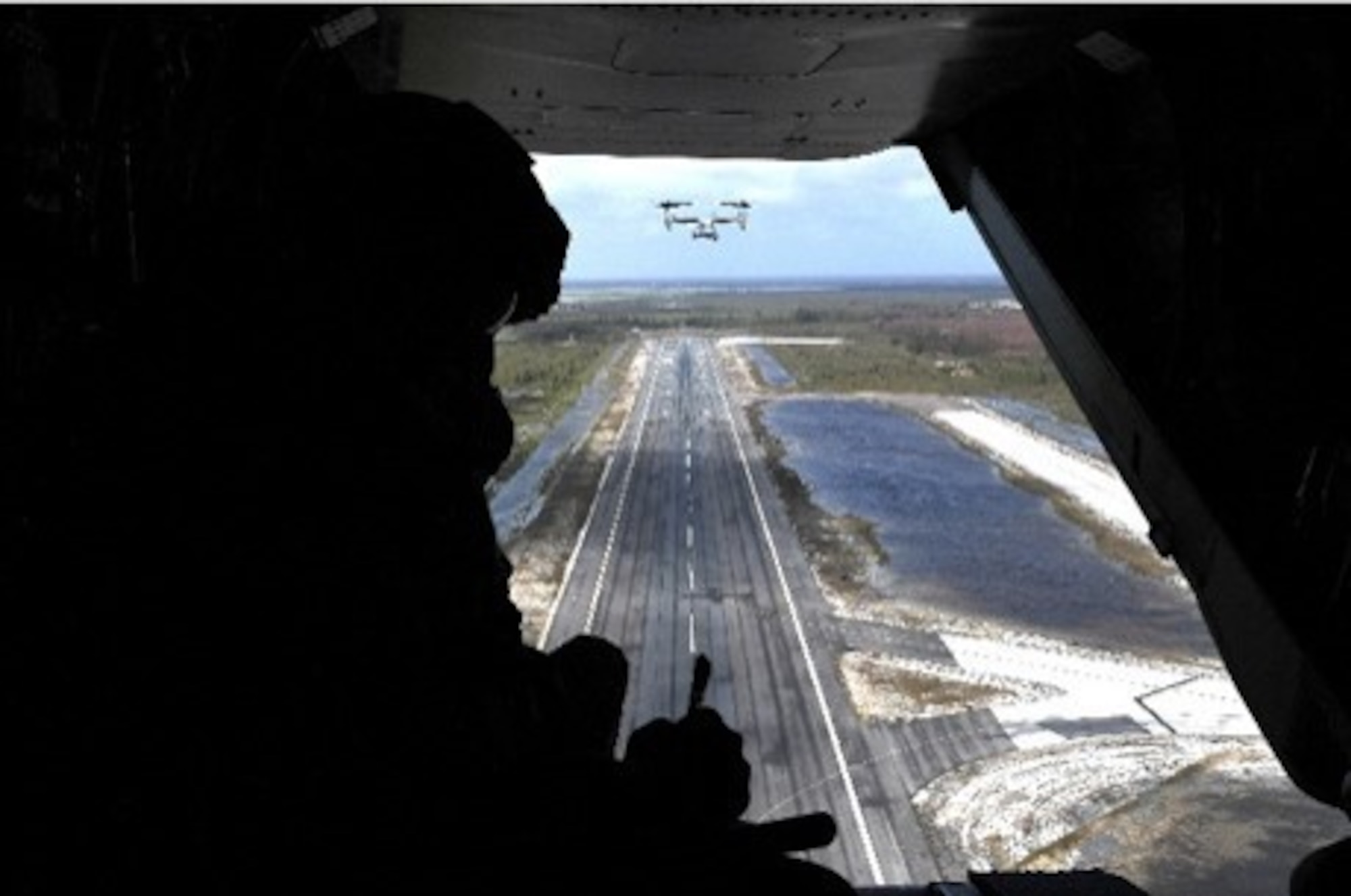 In support of Foreign Disaster Relief efforts in the Bahamas, a U.S. Air Force assessment team member conducts an aerial assessment of Grand Bahama airfield, Sept. 4, 2019. The team will evaluate airfields in The Bahamas to determine if they can safely reopen to receive aircraft providing humanitarian assistance. The Secretary of Defense authorized U.S. Northern Command to provide transportation logistics for the movement of USAID and third party humanitarian commodities and personnel throughout the region and to conduct assessments of critical transportation nodes to facilitate the delivery of humanitarian assistance and maximize the flow of disaster relief into the area. (U.S. Air Force photo by Tech. Sgt. Liliana Moreno)